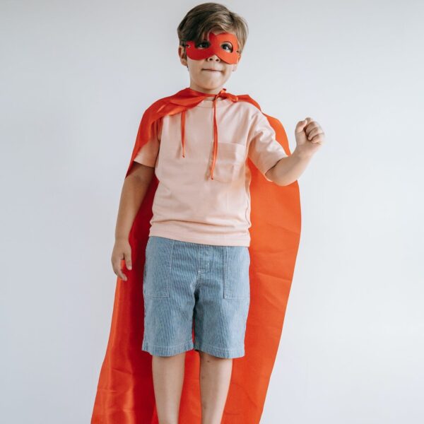Kid in superhero cape